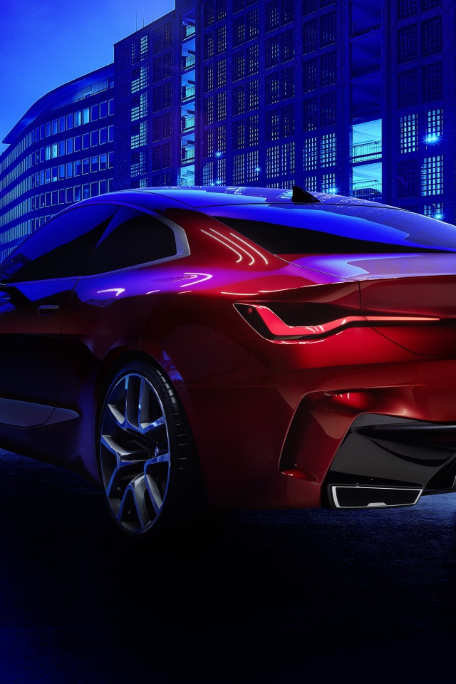 Красный автомобиль BMW Concept 4 2019 года в городе