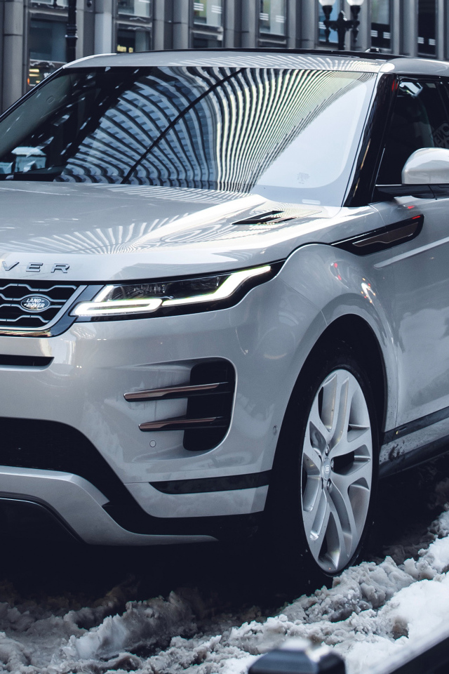 SUV Range Rover Evoque P300 S R-Dynamic 2019 on the snow in the city