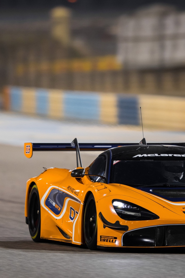 Orange sports car McLaren 720S GT3 on the race track