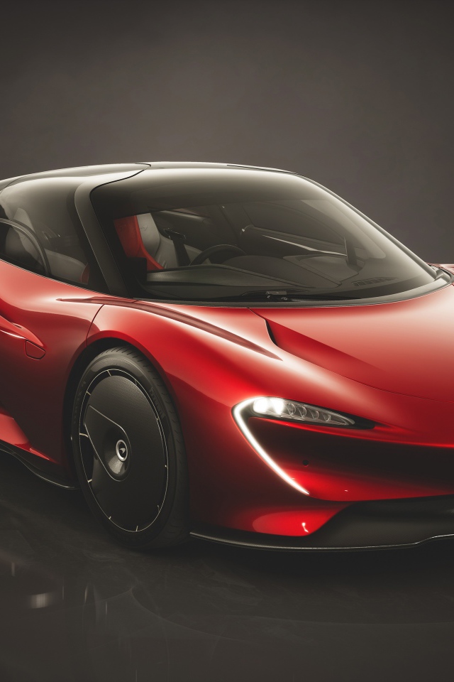 Красный автомобиль McLaren Speedtail Bloodline 2019 года на черном фоне