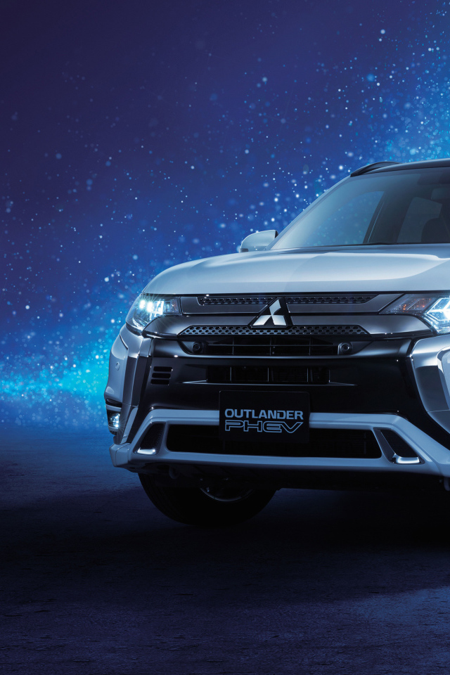 Внедорожник Mitsubishi Outlander  2018 года на неоновом фоне