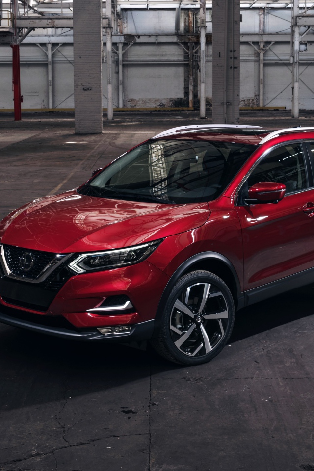 Красный автомобиль Nissan Rogue 