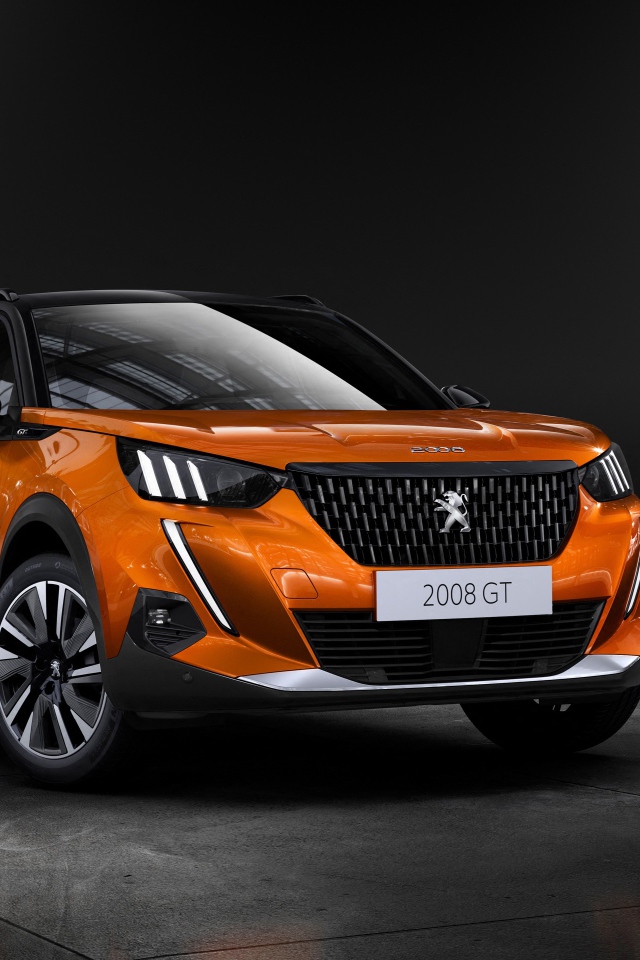 Оранжевый внедорожник Peugeot 2008 GT, 2019  года на сером фоне