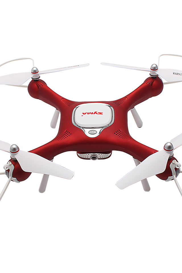 Red drone SYMA X25W on a white background