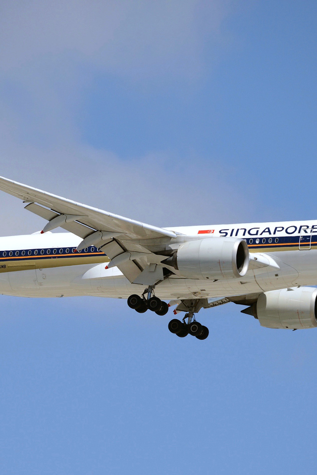 Singapore Airlines airplane in the blue sky