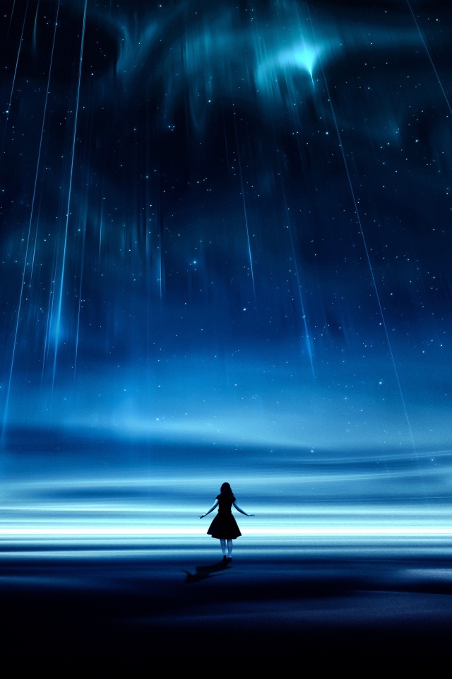 Девушка под фантастическим звездопадом в красивом небе