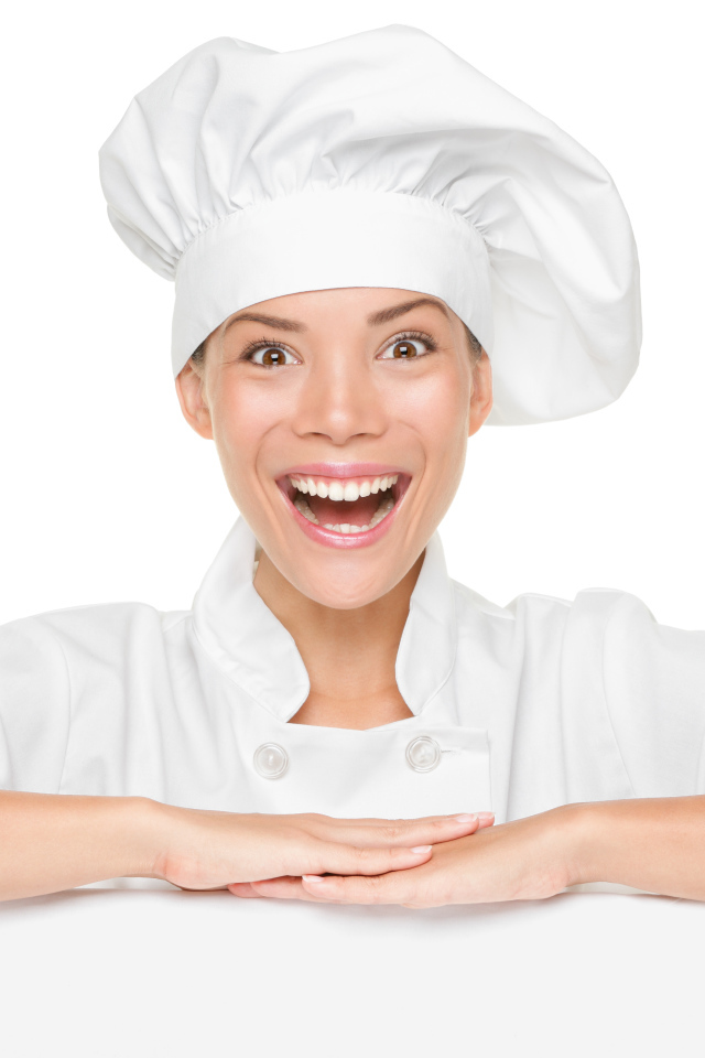 Улыбающаяся девушка повар на белом фоне