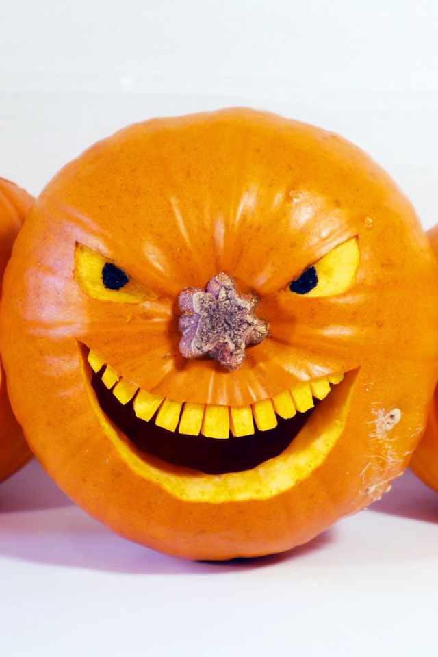 Зловещие тыквы на белом фоне на Хэллоуин 