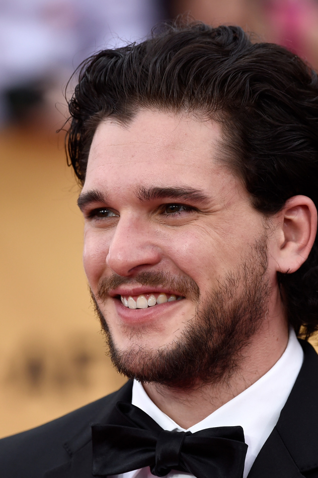 Улыбающийся мужчина, актер Кит Хэрингтон