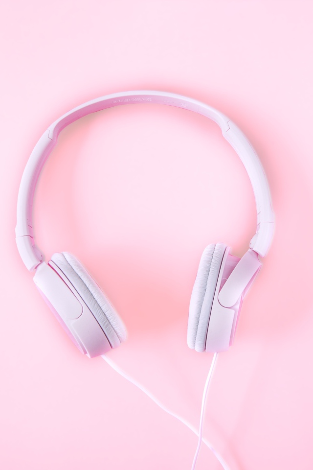 Pink big headphones on a pink background