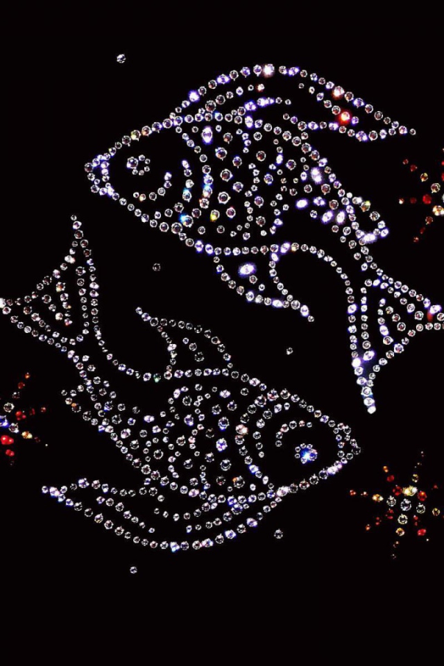 Блестящий знак зодиака рыбы на черном фоне