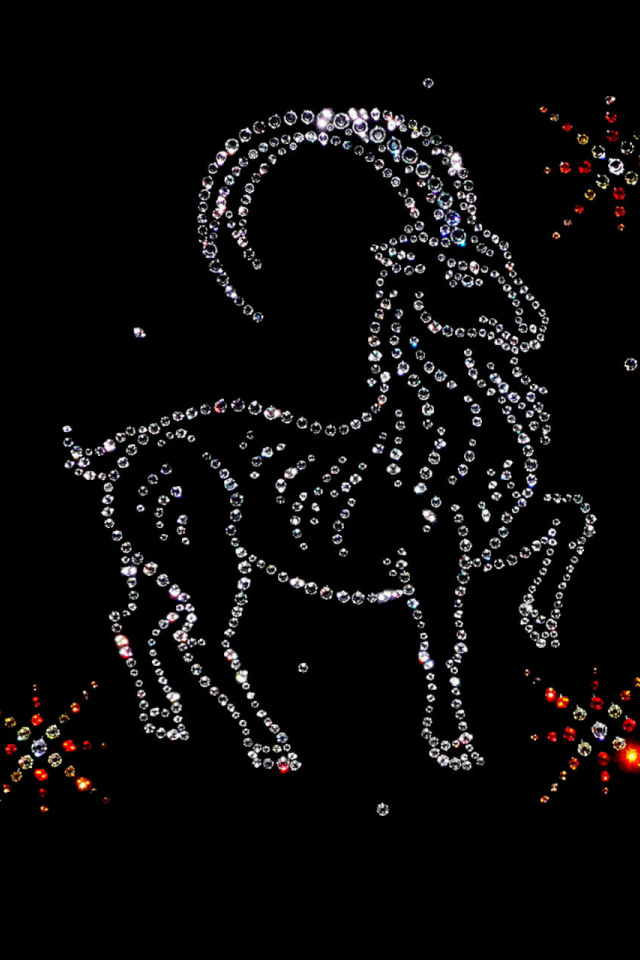 Shiny zodiac sign Capricorn on a black background
