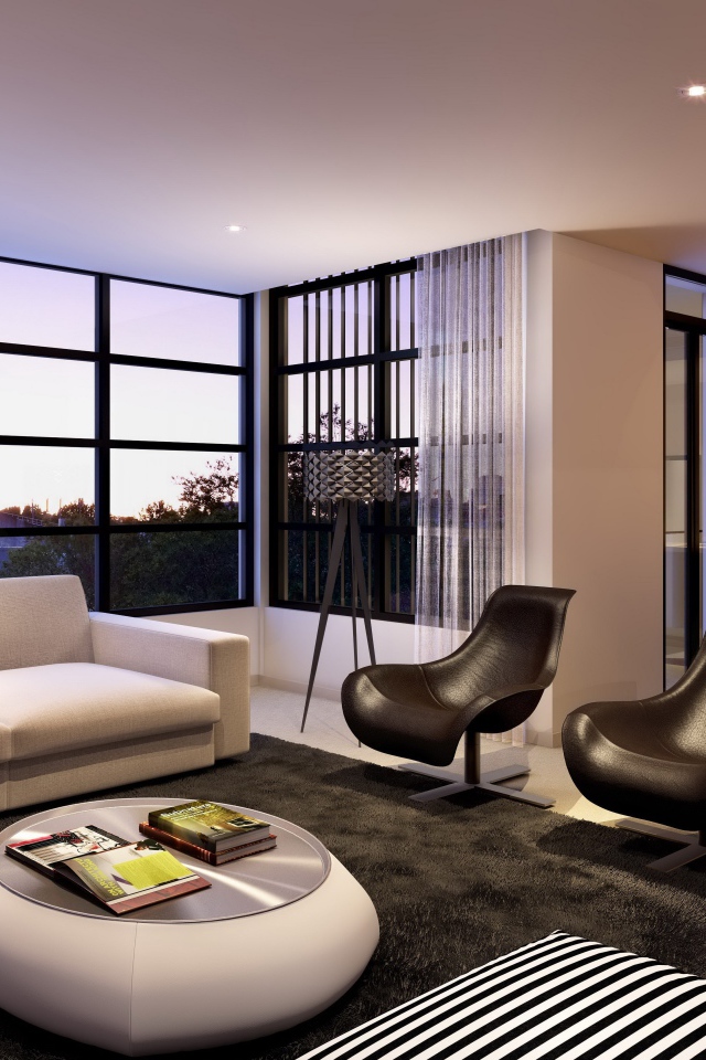 Диван, два кожаных кресла и стол в гостиной с большим окном 