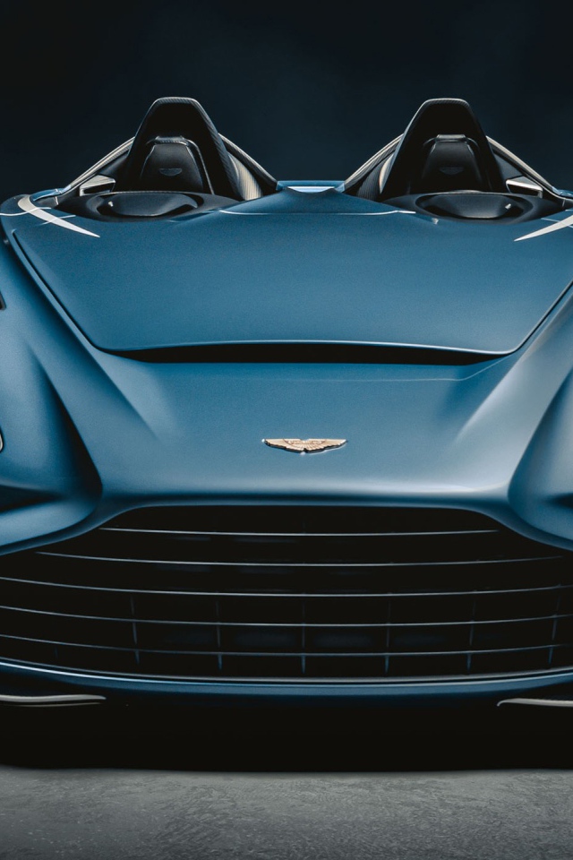 Автомобиль Aston Martin V12 Speedster 2020 года на сером фоне