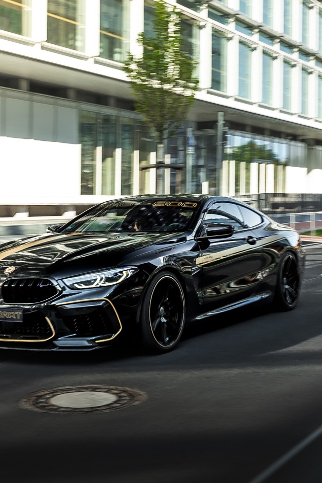 Черный стильный автомобиль BMW Manhart MH8 800, 2020 года на улице города