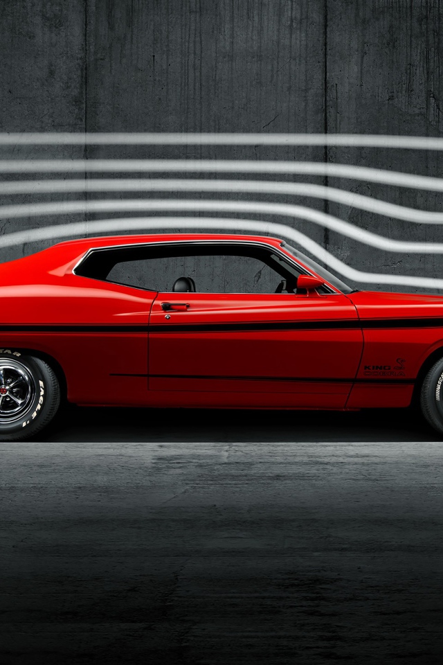 Красный ретро автомобиль Ford Torino King Cobra, 1970 года