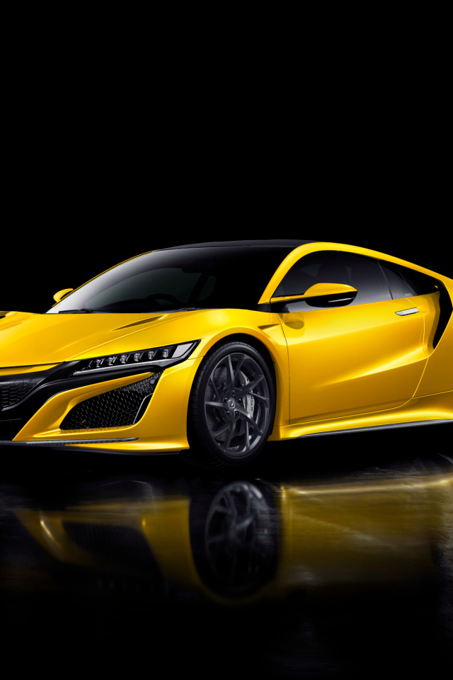 Желтый автомобиль Honda NSX на черном фоне