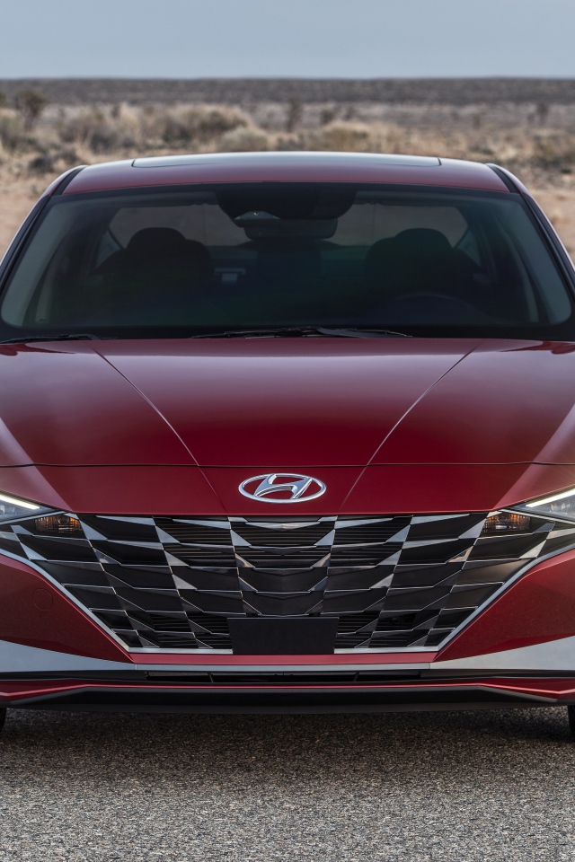 Красный автомобиль  Hyundai Elantra, 2021 года на пустыре