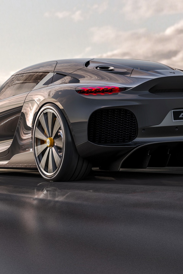 Быстрый автомобиль Koenigsegg Gemera 2020 года на трассе вид сзади