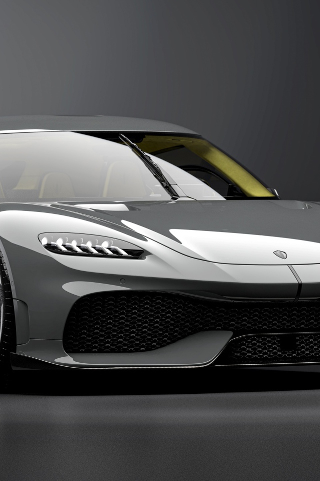 Быстрый автомобиль Koenigsegg Gemera 2020 года на сером фоне