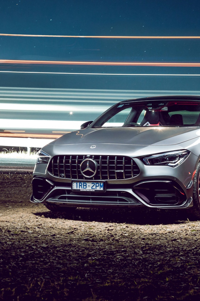 Серебристый автомобиль Mercedes-AMG CLA 45 S 4MATIC, 2020 года у трассы 