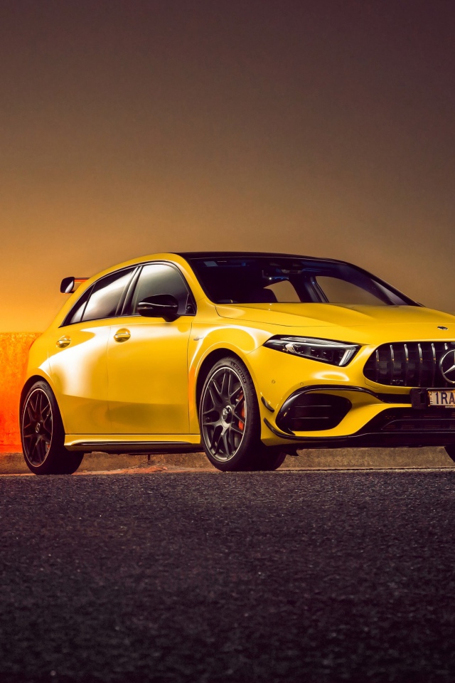 Желтый автомобиль Mercedes-AMG A 45 S,  2020 года на асфальте 