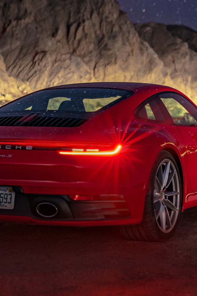 Red car Porsche 911 Carrera S, 2020 in the mountains at night