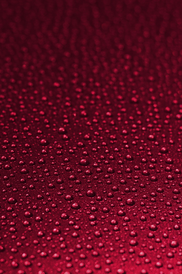 Красный фон с каплями воды 