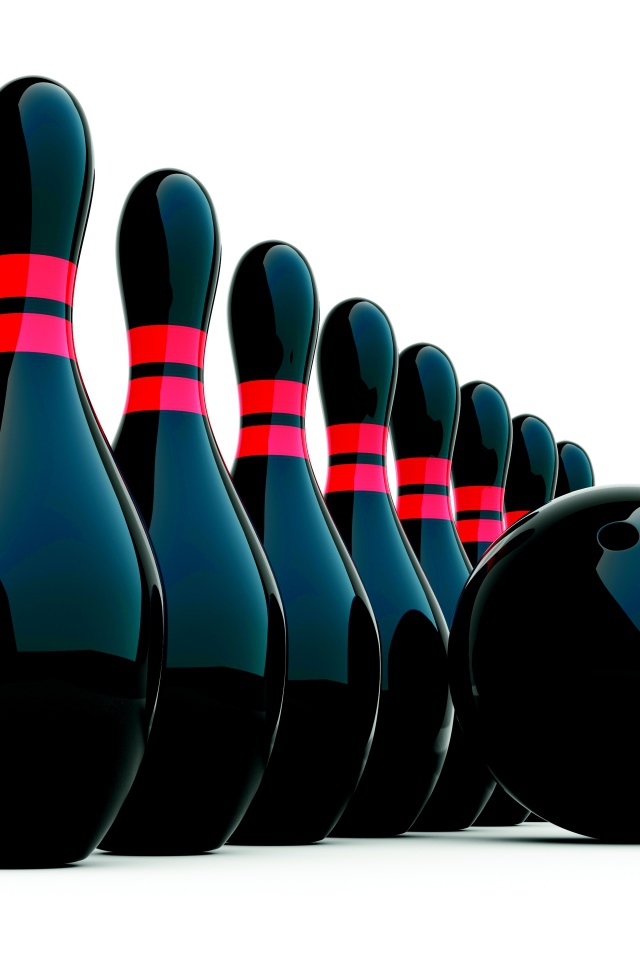 Черные кегли и шар для боулинга на белом фоне