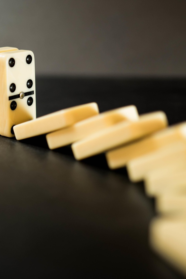 Dice for playing dominoes on a black table