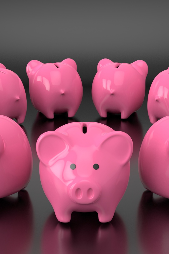 Много розовых свиней копилок на сером фоне