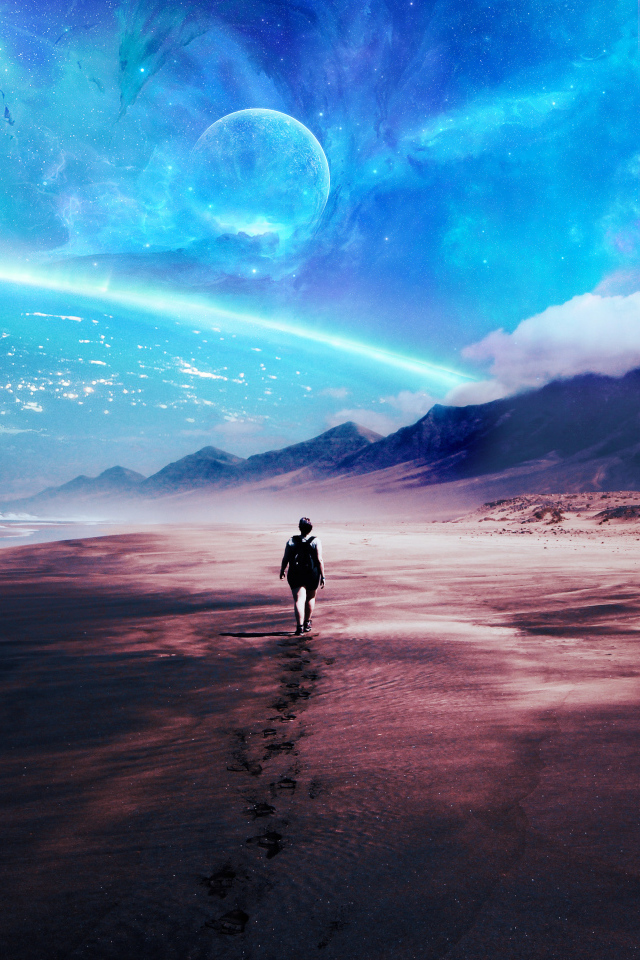 Человек идет по песку на фоне фантастического неба