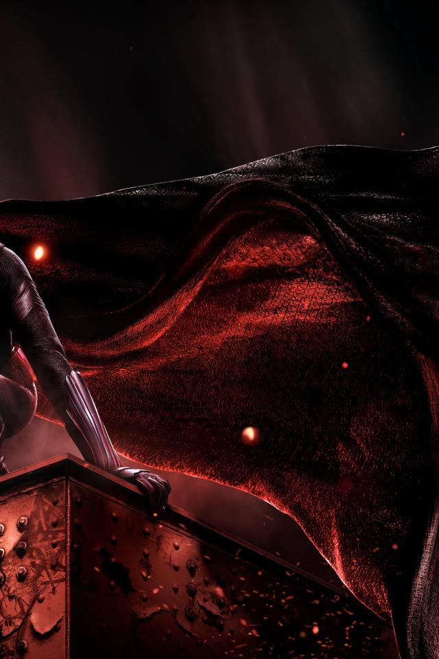 Супергерой Бэтвумен в черном плаще на крыше