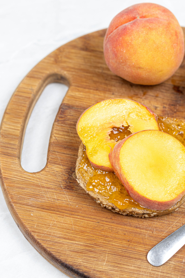 Fresh peaches on the table with bread