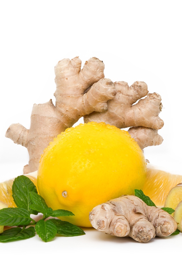 Lemon with ginger root and mint on white background