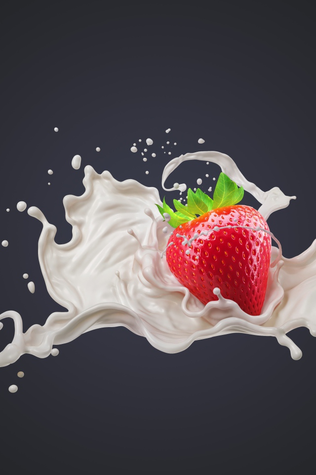 Красная клубника в молоке на сером фоне