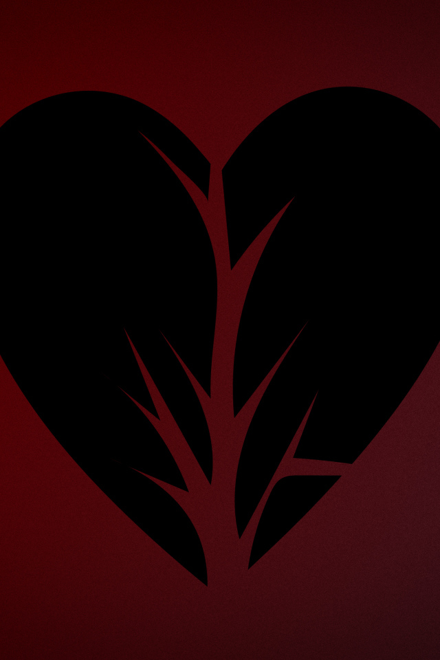 Черное разорванное сердце на красном фоне