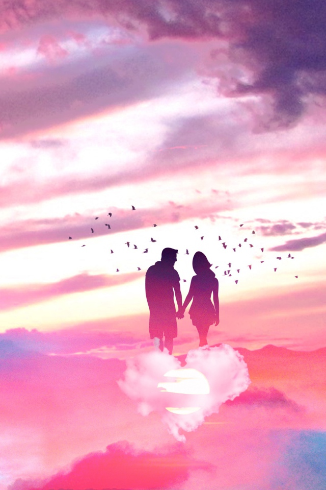 Silhouette of a couple in love on a cloud in the shape of a heart in the sky