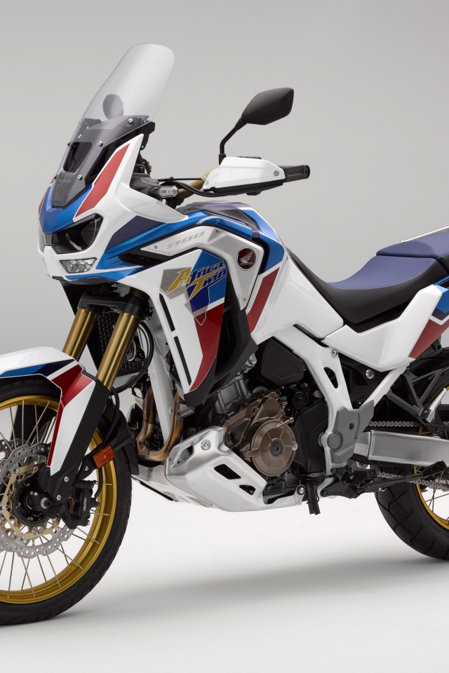 Спортивный мотоцикл Honda  CRF 1000 D, 2020  года на сером фоне