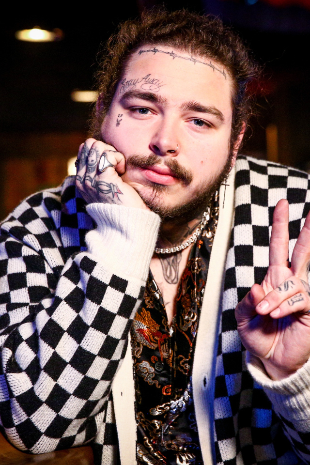 American singer, rapper Post Malone with tattoos on his body