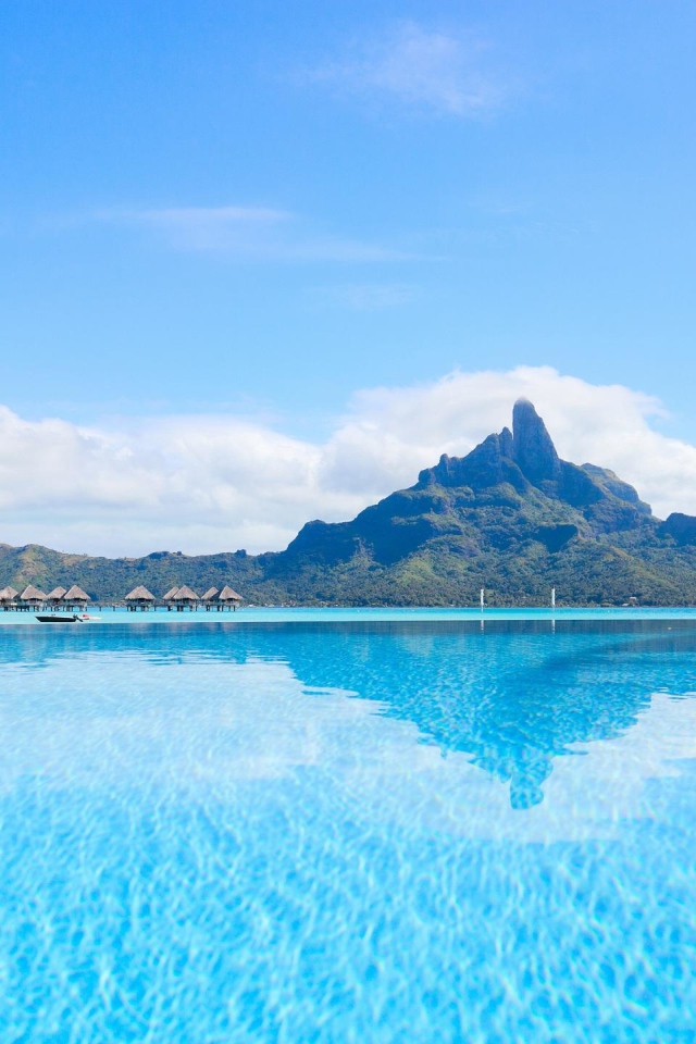 View of the blue water of Bora Bora island in the background of the mountain