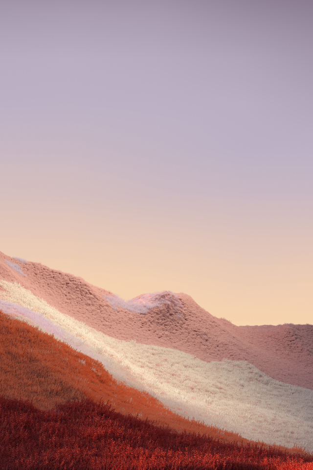 Покрытые травой горы на фоне неба