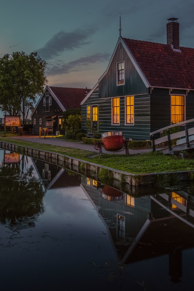 Small houses by the pond in the evening