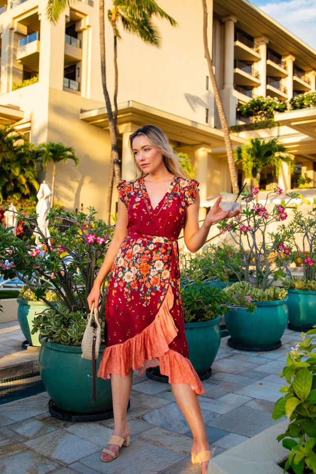 Actress Katrina Bowden in a dress on a background of the house