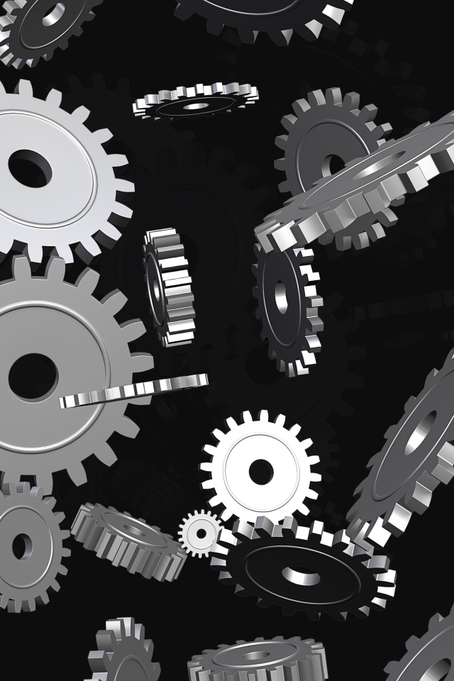 Металлические шестеренки в воздухе на черном фоне