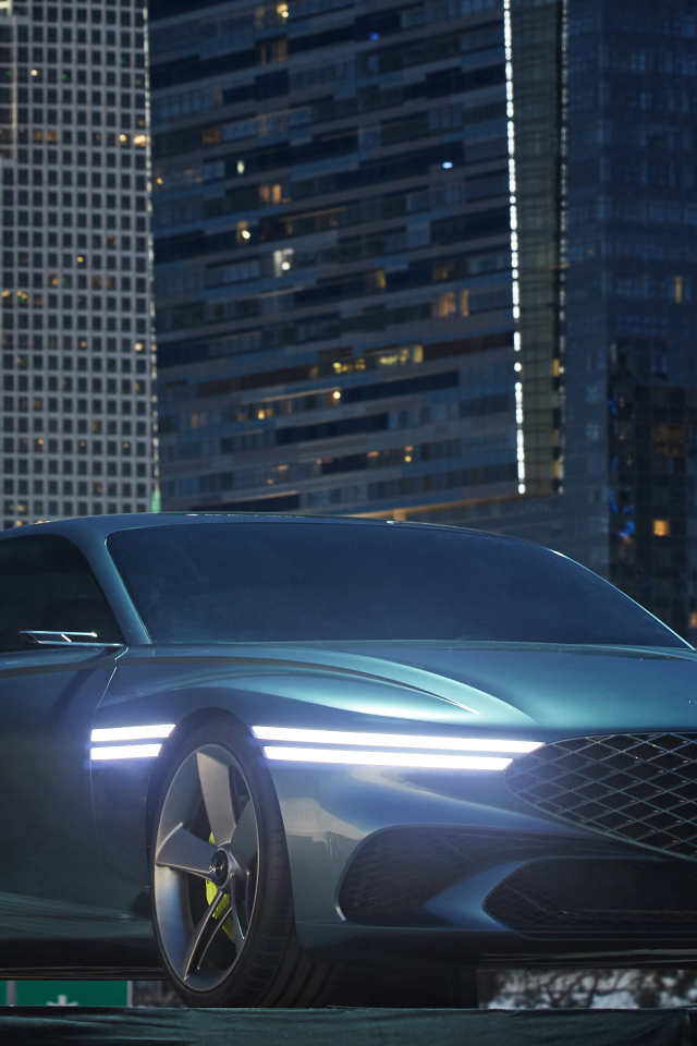 New 2021 Genesis X Concept car set against skyscrapers