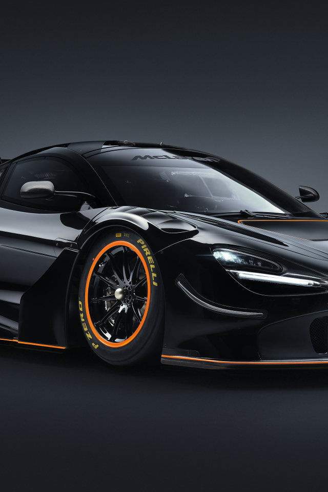 Черный спортивный автомобиль McLaren 720S GT3X 2021 года на сером фоне