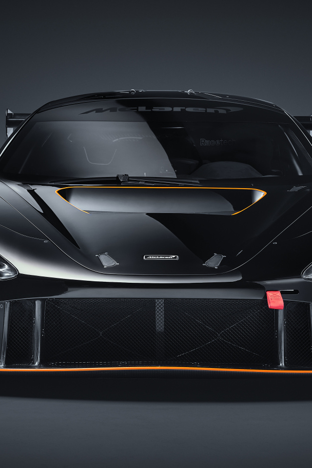Автомобиль McLaren 720S GT3X 2021 года вид спереди на сером фоне