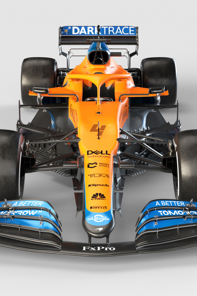 Гоночный автомобиль McLaren MCL35M 2021 года на сером фоне