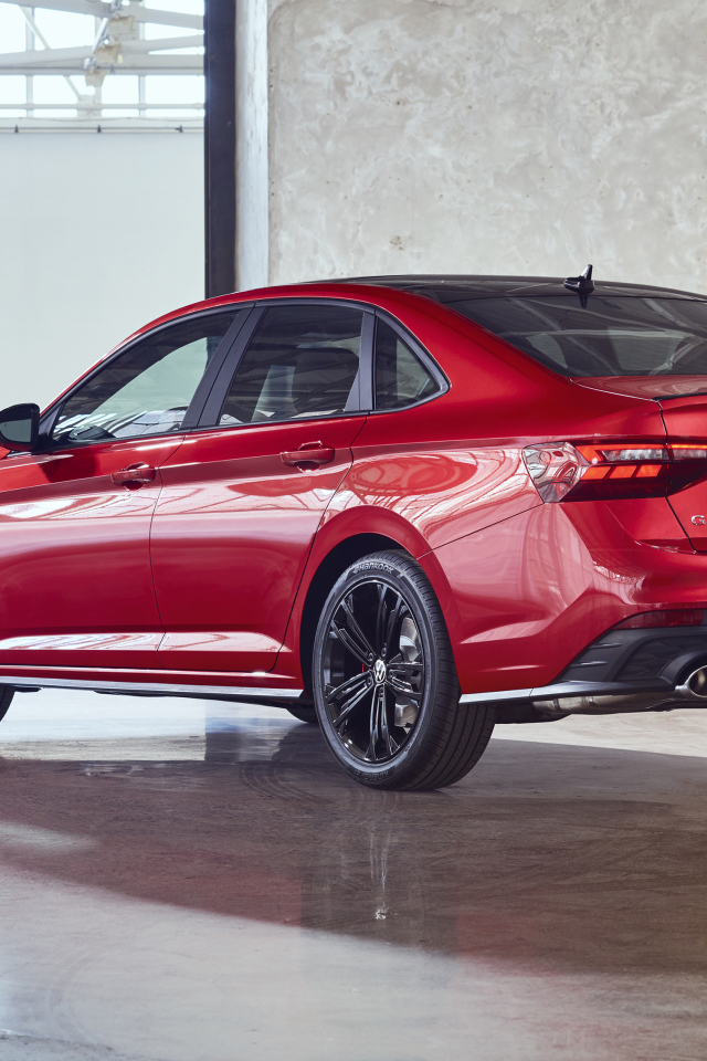 Красный автомобиль Volkswagen Jetta GLI, 2022 года вид сзади